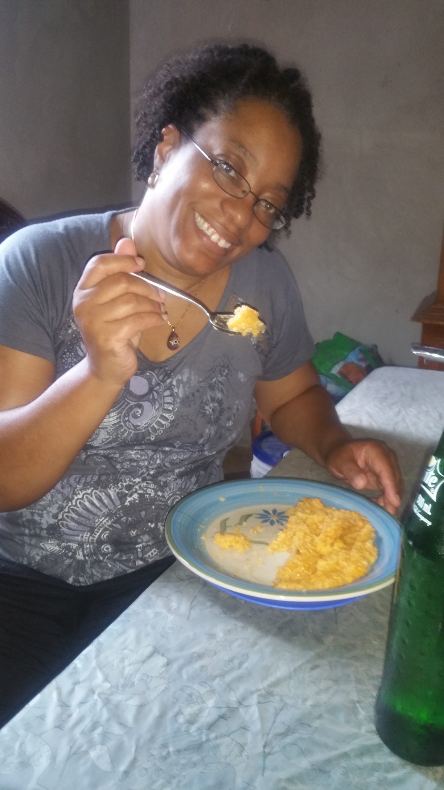 Tanya enjoying a healthy meal of Haitian Mayi Moulen in Haiti