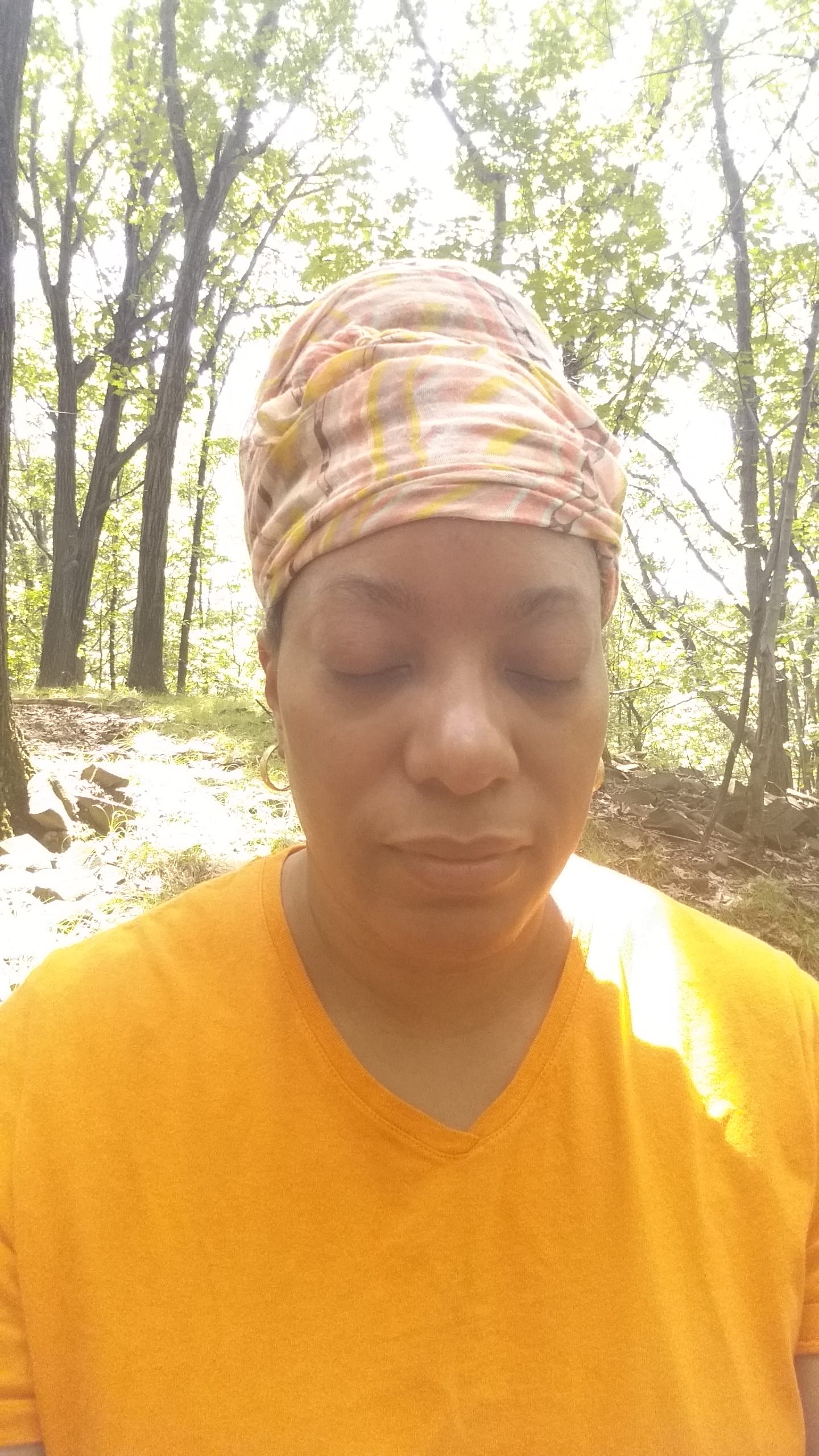 Mental Health Awareness. Going Inward. Tanya meditating in the park as a form of self care.