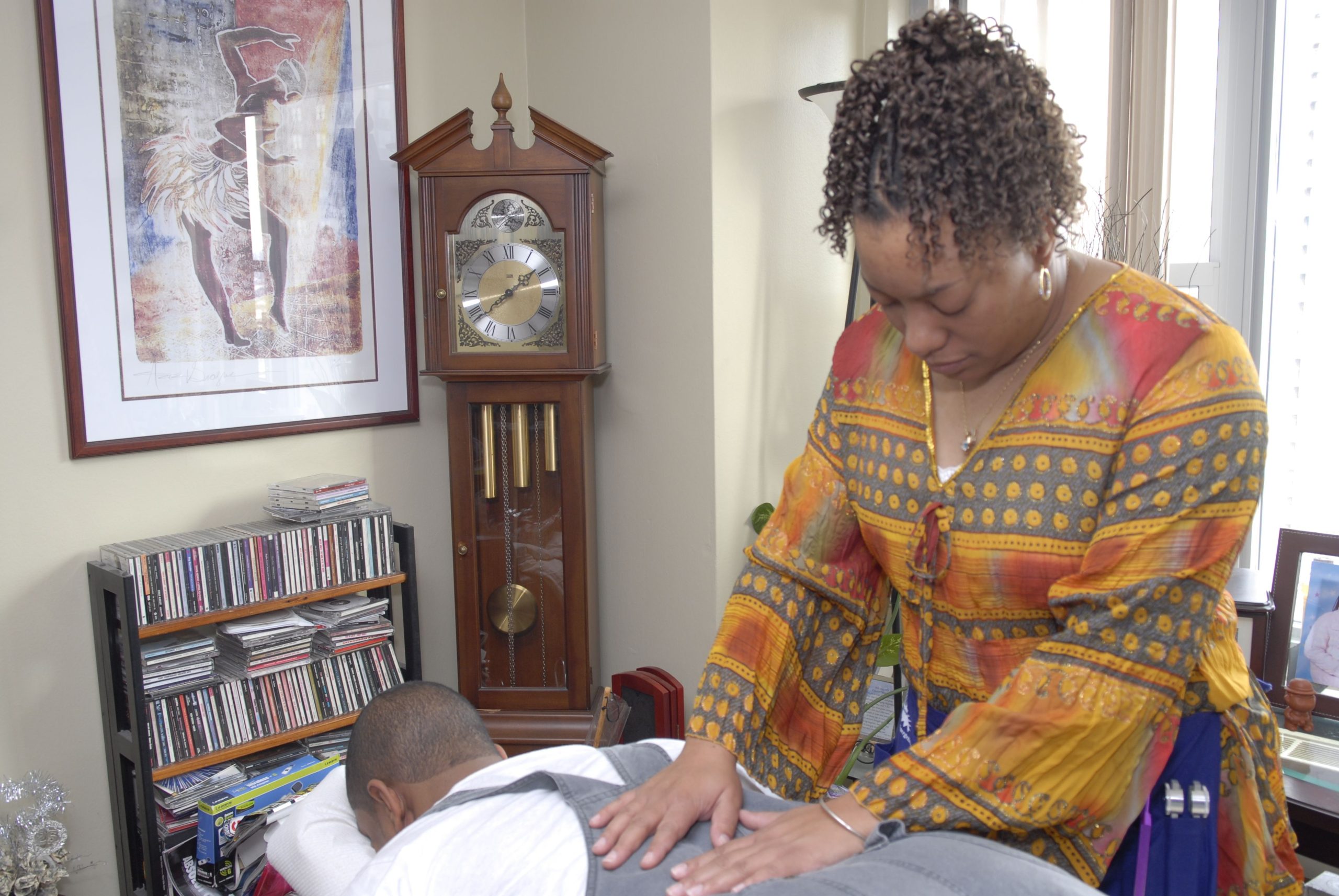 Tanya Lawson demonstrating hands-on healing techniques for holistic wellness
